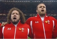 Picture of a Welsh Forward and Back singing the Welsh national anthem in full voice